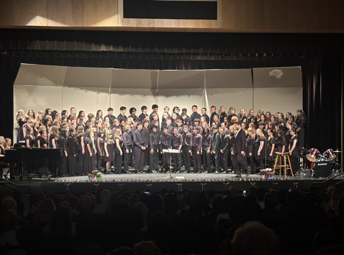 Caption: Performers stand before the audience prior to starting the performance. (Leo McDunn).